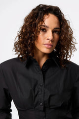 Darcy Shirt in Black by Mossman, a structured cropped cotton shirt with shoulder pads and exposed button front.
