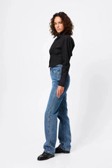 Darcy Shirt in Black by Mossman, a structured cropped cotton shirt with shoulder pads and exposed button front.