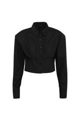 Darcy Shirt in Black by Mossman, a structured cropped cotton shirt with shoulder pads and exposed button front.