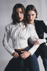 Darcy Shirt in White by Mossman, a structured cropped cotton shirt with shoulder pads and exposed button front.