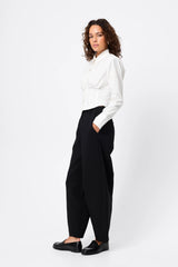 Darcy Shirt in White by Mossman, a structured cropped cotton shirt with shoulder pads and exposed button front.