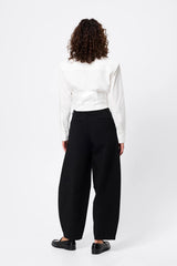 Darcy Shirt in White by Mossman, a structured cropped cotton shirt with shoulder pads and exposed button front.