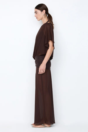 Delilah Overlay Dress in Dark Chocolate by Bec + Bridge, an off-shoulder sheer georgette maxi with removable slip for versatile, elegant occasions.