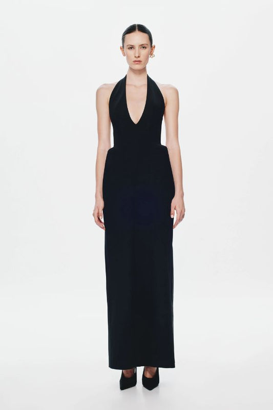 Delta Suiting Maxi Dress by Misha, a black halter gown with padded hips, corsetry seams, and back slit. Perfect for statement evenings.