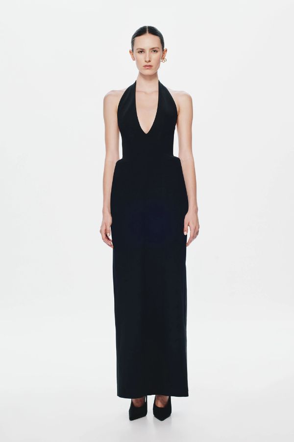 Delta Suiting Maxi Dress by Misha, a black halter gown with padded hips, corsetry seams, and back slit. Perfect for statement evenings.
