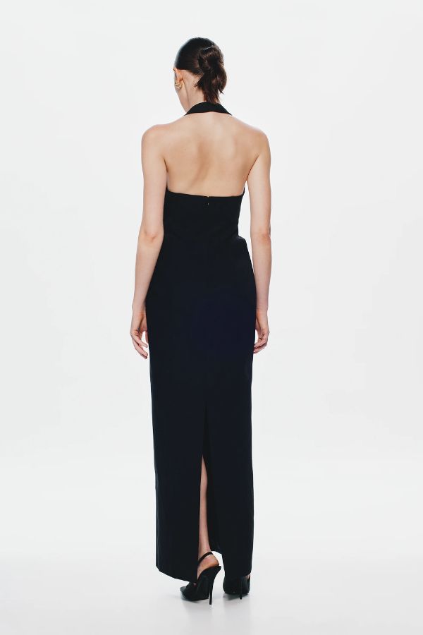 Delta Suiting Maxi Dress by Misha, a black halter gown with padded hips, corsetry seams, and back slit. Perfect for statement evenings.