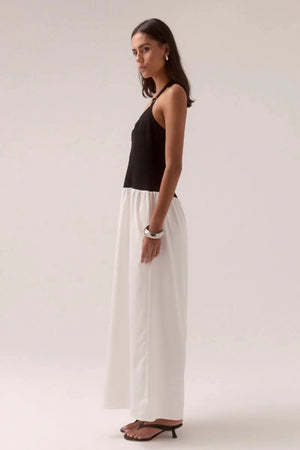 Demi Dress Black/Chalk by Sovere, halter maxi with scooped neckline and flowy skirt, a trendy piece perfect for elegant evenings or events.