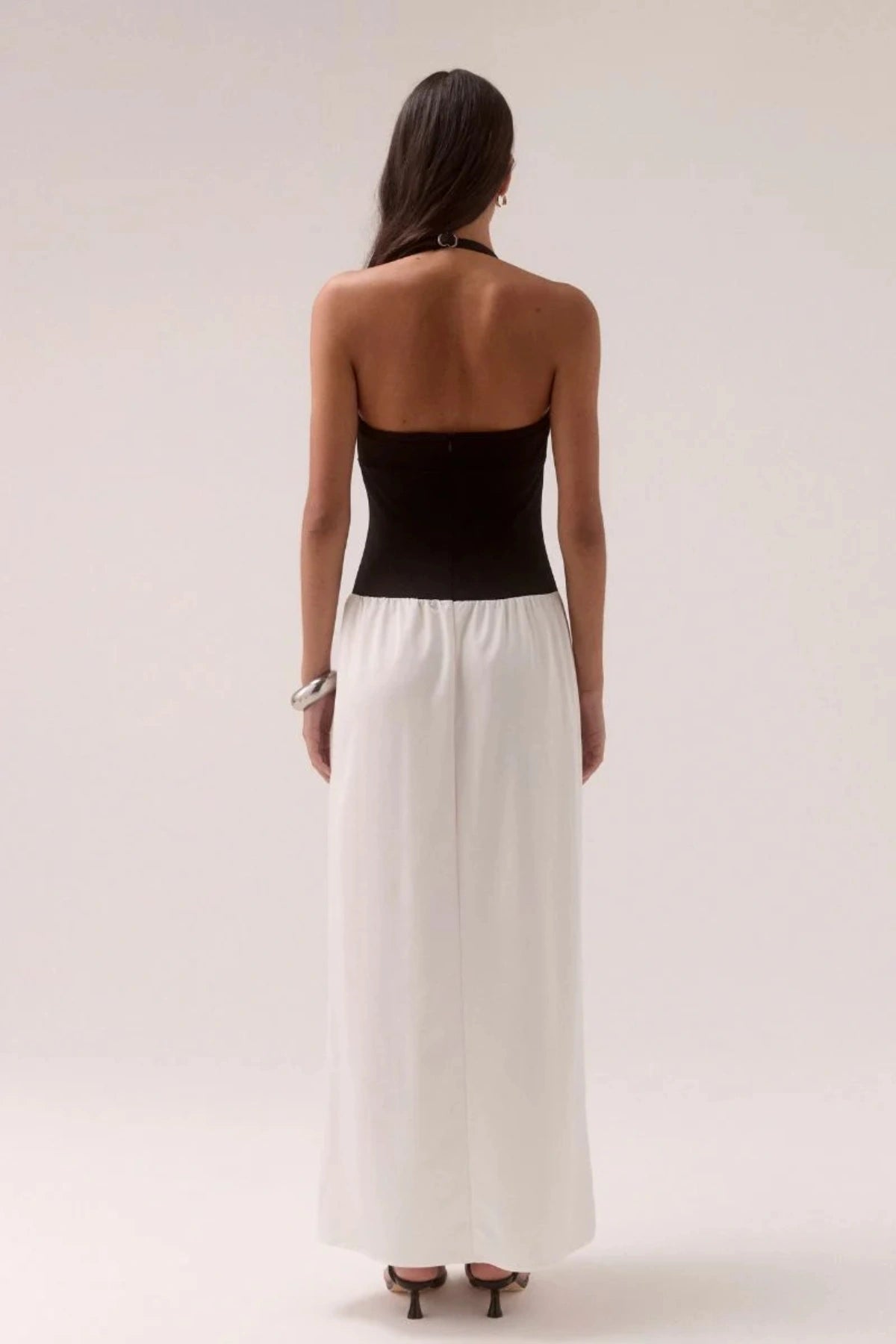 Demi Dress Black/Chalk by Sovere, halter maxi with scooped neckline and flowy skirt, a trendy piece perfect for elegant evenings or events.