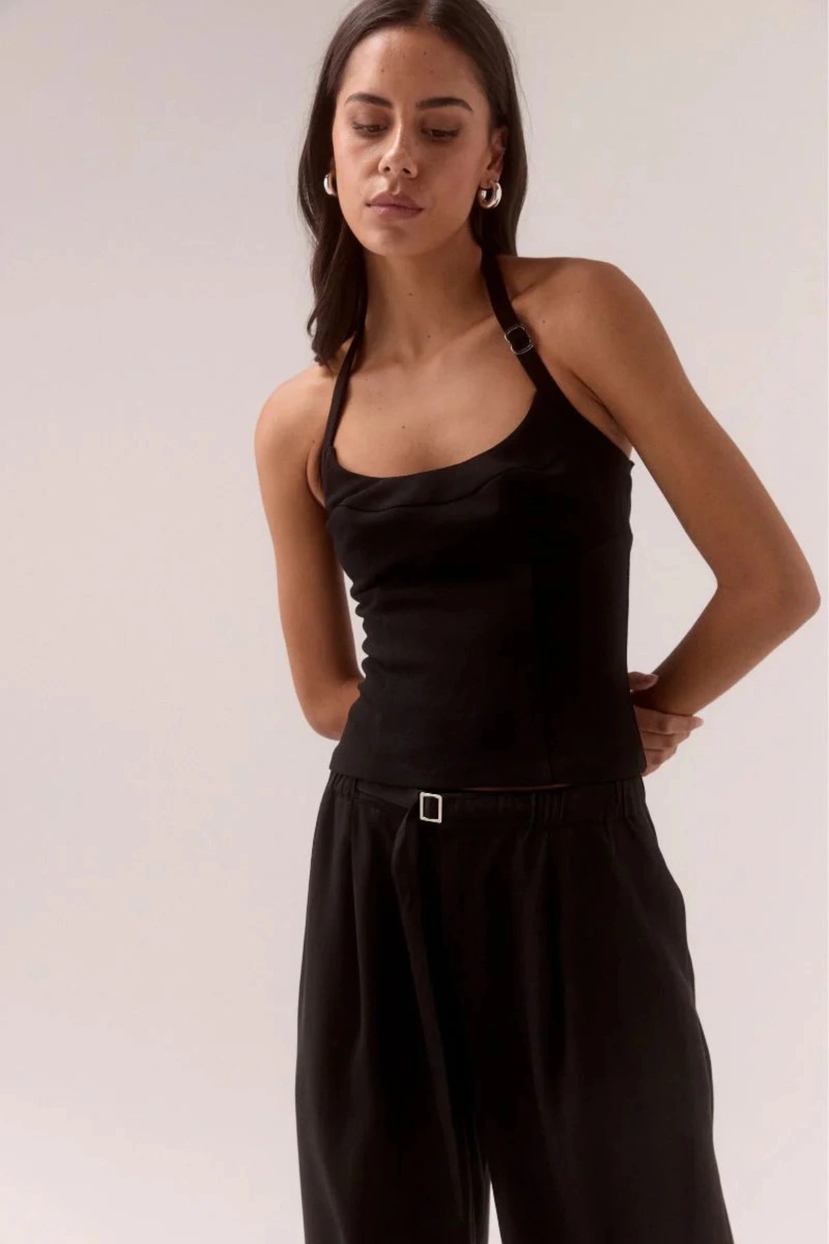 Demi Top Black by Sovere, halter top with scooped neckline and silver slider details, a trendy piece perfect for chic day to night styling.