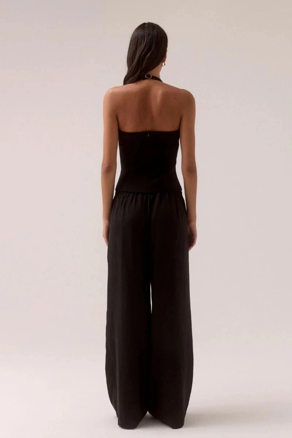 Demi Top Black by Sovere, halter top with scooped neckline and silver slider details, a trendy piece perfect for chic day to night styling.