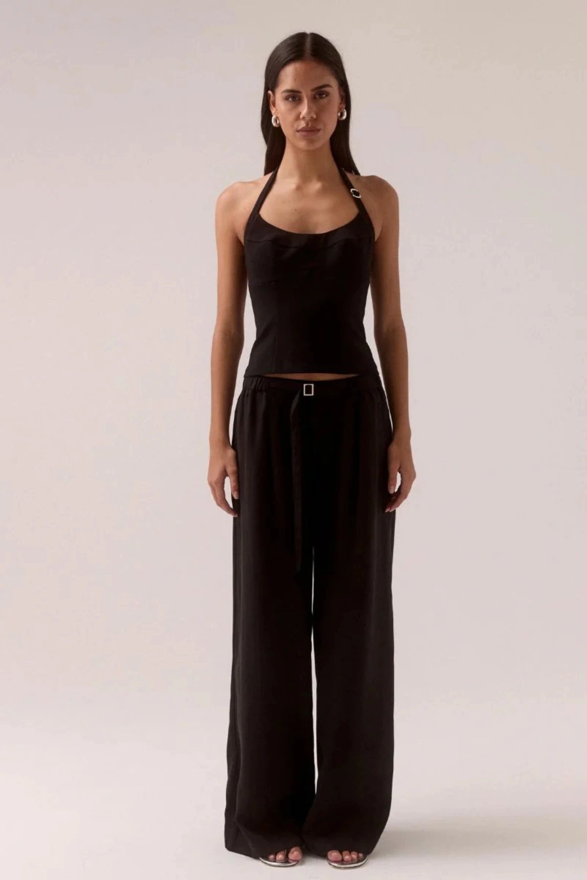 Demi Top Black by Sovere, halter top with scooped neckline and silver slider details, a trendy piece perfect for chic day to night styling.