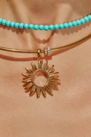Desert Heat Choker Gold by Emma Pills - wire choker with sun charm and gold beads, designed for a bold sculptural statement.
