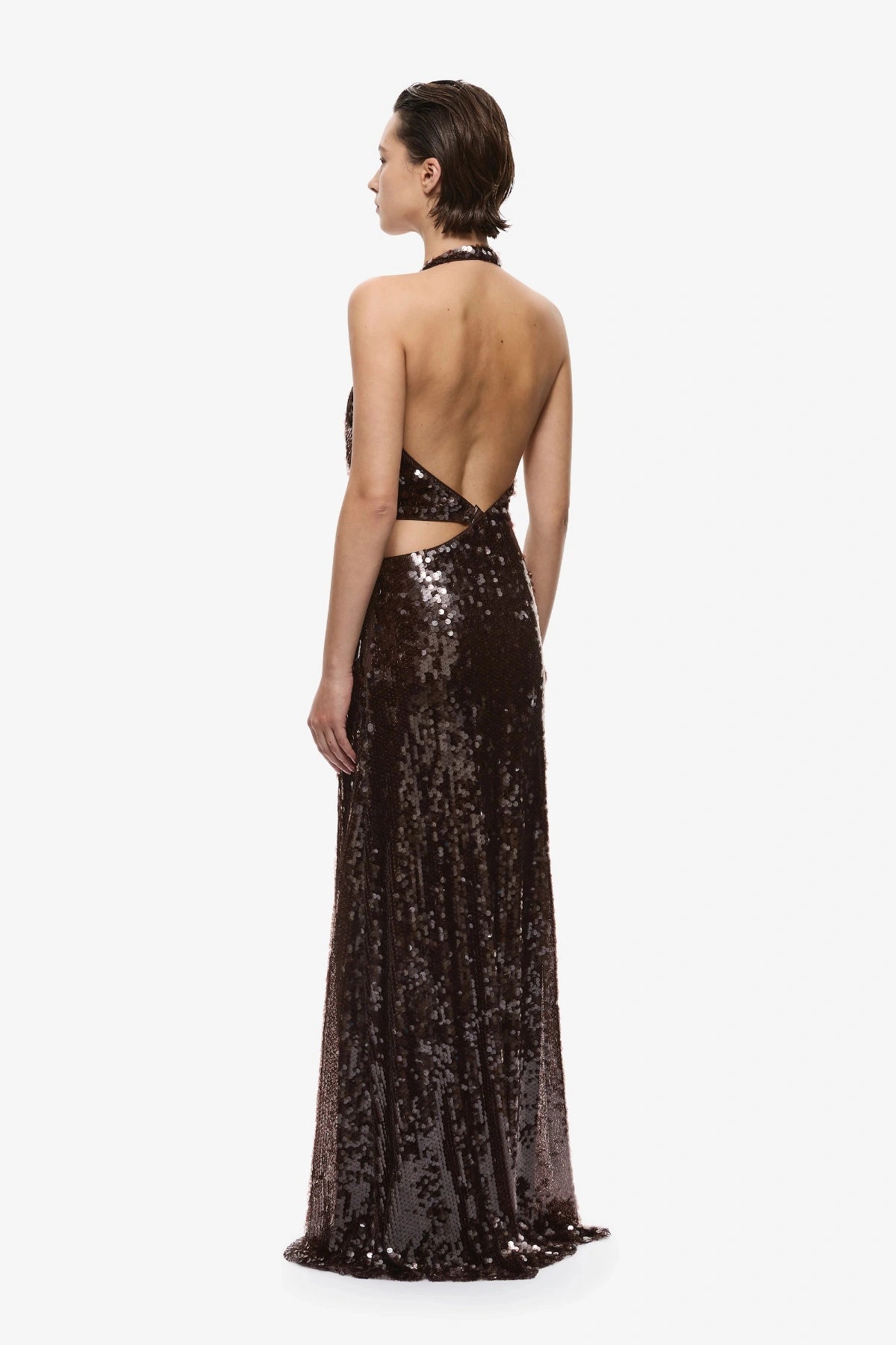 Devon Sequin Dress Chocolate by Misha, an asymmetric plunge sequin gown with metal ring details and an open back for dramatic evening wear.
