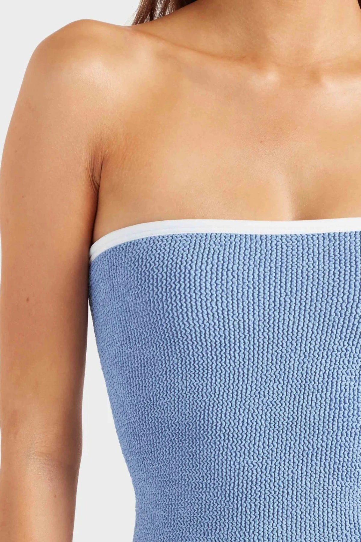 Devyn Swimskirt by Hunza G, a crinkle-textured piece worn as a tube top or skirt. Perfect for beach layering or versatile summer styling.