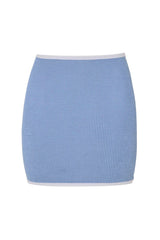 Devyn Swimskirt by Hunza G, a crinkle-textured piece worn as a tube top or skirt. Perfect for beach layering or versatile summer styling.