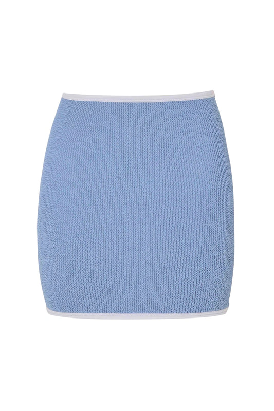 Devyn Swimskirt by Hunza G, a crinkle-textured piece worn as a tube top or skirt. Perfect for beach layering or versatile summer styling.