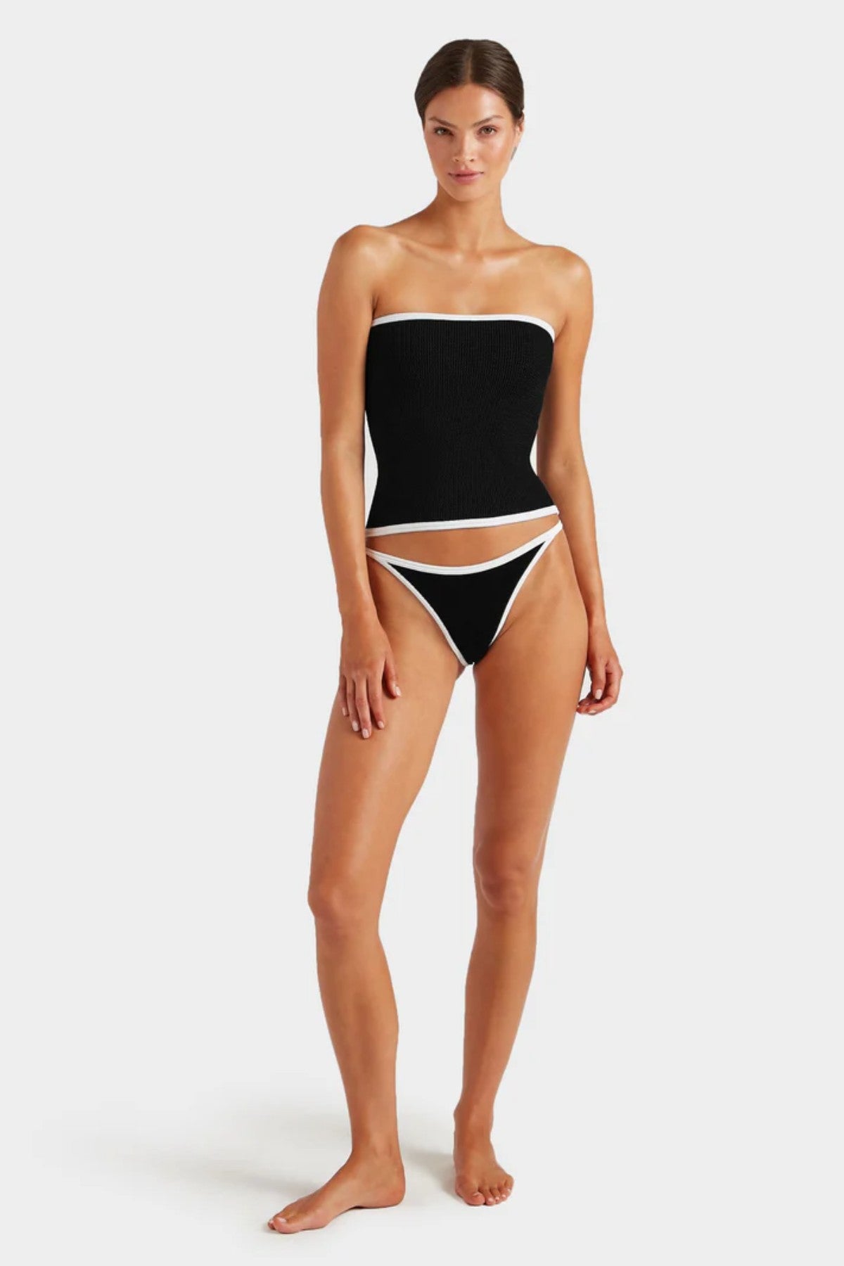 Devyn Swimskirt by Hunza G, versatile crinkle design that flatters as a mini swim skirt or tube top. Ideal for sunny seaside adventures.