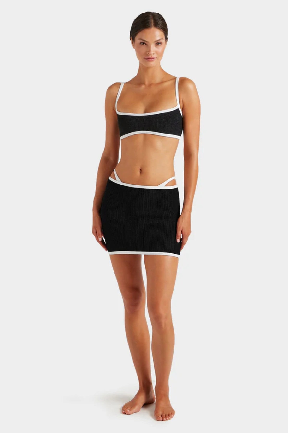 Devyn Swimskirt by Hunza G, versatile crinkle design that flatters as a mini swim skirt or tube top. Ideal for sunny seaside adventures.