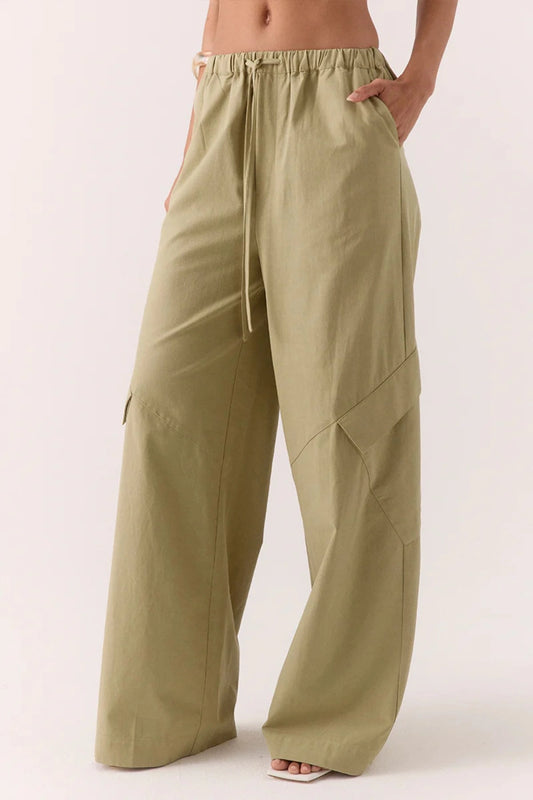Dex Pant in Soft Khaki by Sovere – relaxed straight-leg pant with drawstring waist and utility pockets. Perfect for casual everyday wear.