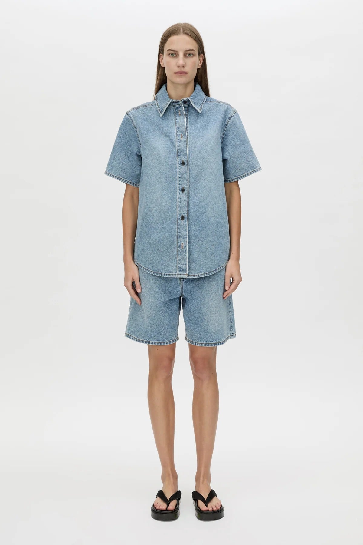 Diego Denim Shirt by Camilla and Marc — a light vintage blue short-sleeve denim shirt with a boxy fit and branded buttons.