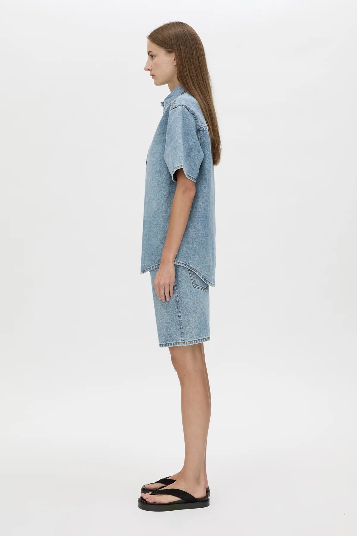 Diego Denim Shirt by Camilla and Marc — a light vintage blue short-sleeve denim shirt with a boxy fit and branded buttons.