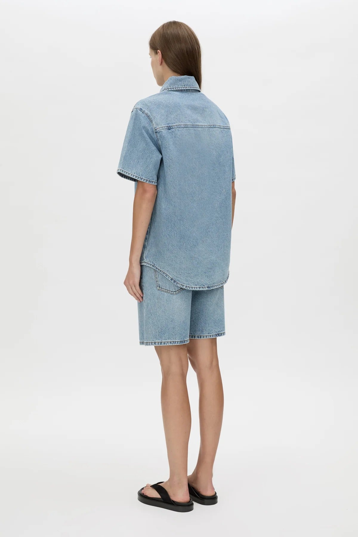 Diego Denim Shirt by Camilla and Marc — a light vintage blue short-sleeve denim shirt with a boxy fit and branded buttons.