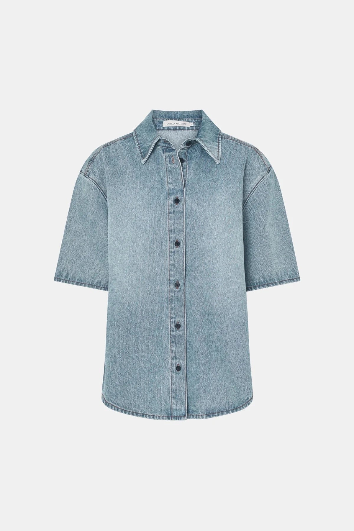 Diego Denim Shirt by Camilla and Marc — a light vintage blue short-sleeve denim shirt with a boxy fit and branded buttons.