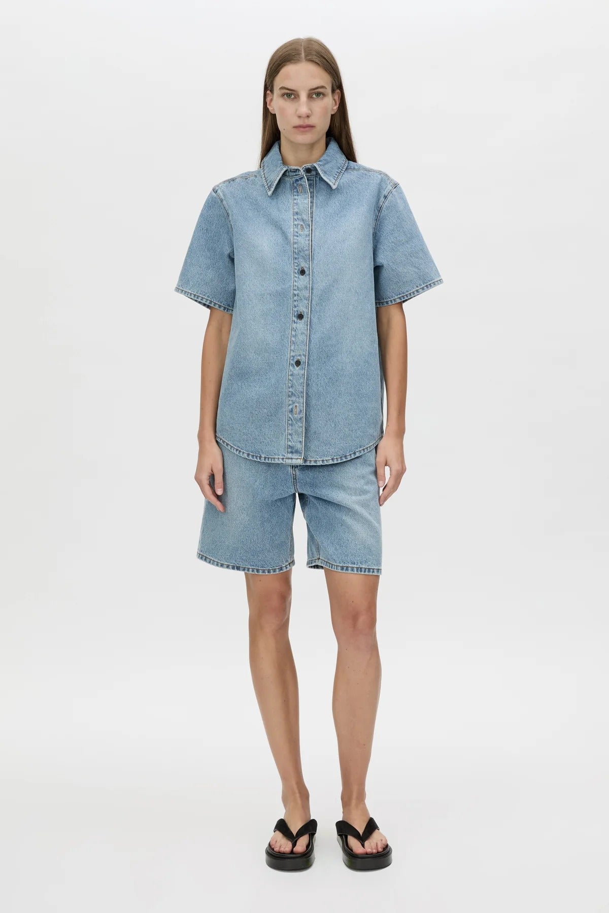 Diego Denim Shirt by Camilla and Marc — a light vintage blue short-sleeve denim shirt with a boxy fit and branded buttons.