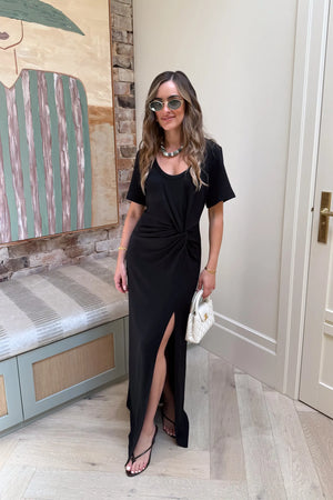 Dimitra Maxi Dress Black by Sneaky Link – a maxi dress with front knot and fitted shape. Perfect for day-to-night styling.