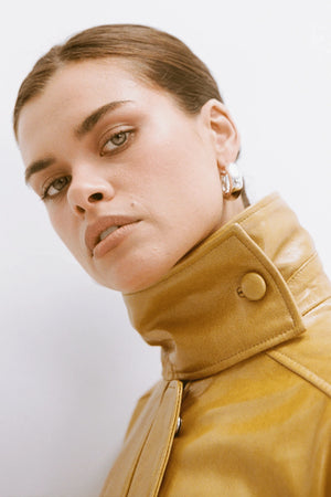 Dina Hoops White Gold by Porter Jewellery – glossy statement hoop earrings with sterling silver base, water-resistant and hypoallergenic.
