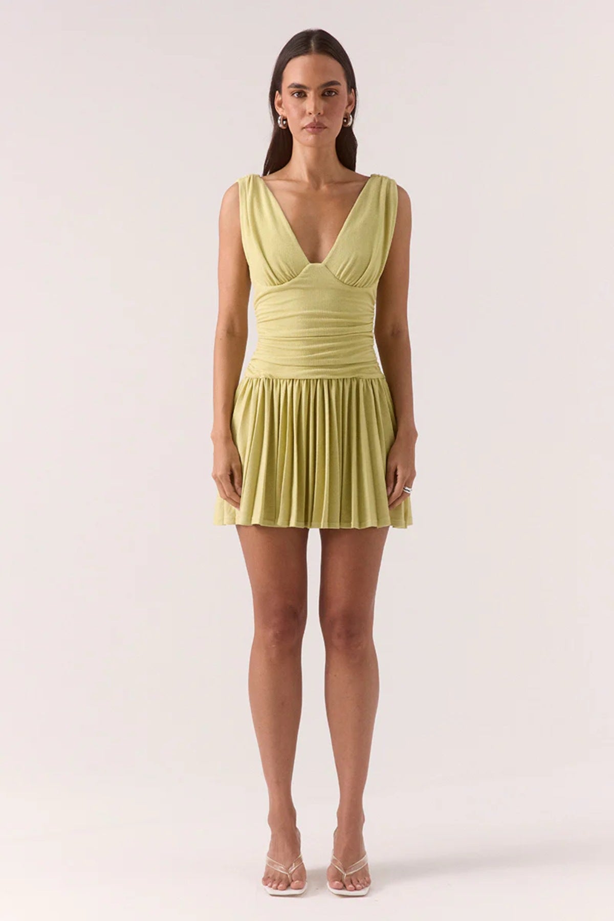 Dione Mini Dress Apple by Sovere, vibrant dropped-waist mini with layered bralette, gathered bodice, and pleated skirt for sculptural feminine flair.