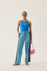 Dolphine Tank by Araminta James — a French Blue ribbed racer tank with dolphin embroidery, perfect for warm-weather casual styling.