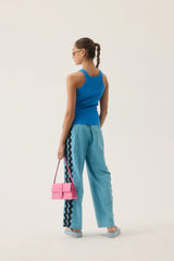 Dolphine Tank by Araminta James — a French Blue ribbed racer tank with dolphin embroidery, perfect for warm-weather casual styling.