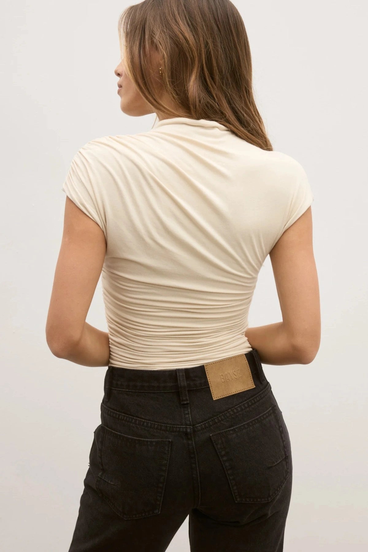 Dove Top in Jasmine by Bayse, elegant one-shoulder jersey top featuring gathered draping for a flattering, feminine silhouette.