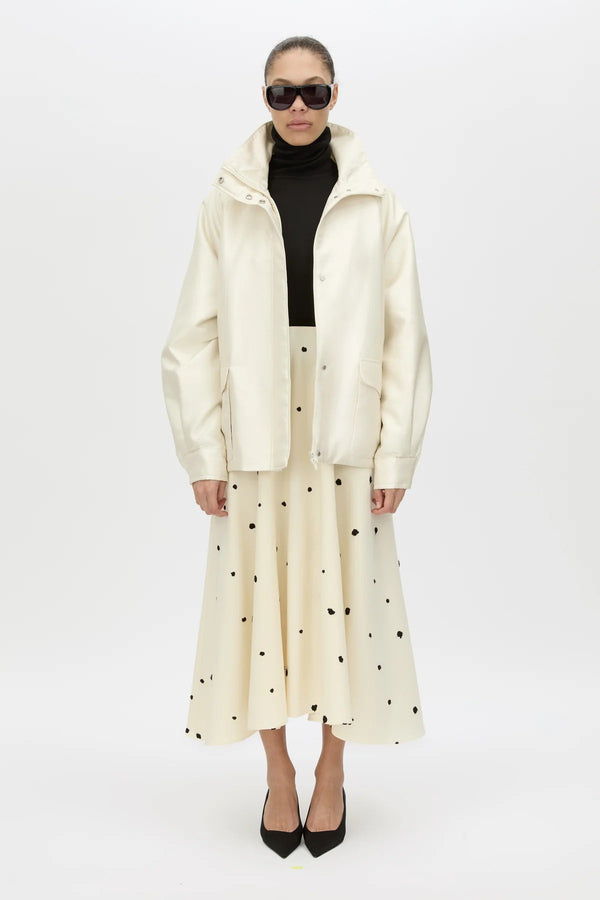 Drea Puffer Jacket by Camilla and Marc, a cream funnel-neck puffer with waist belt, raglan sleeves and detachable throat latch.