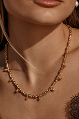 Dubai Necklace by Amber Sceats - gold necklace with textured teardrop pendants, designed for bold elevated styling.