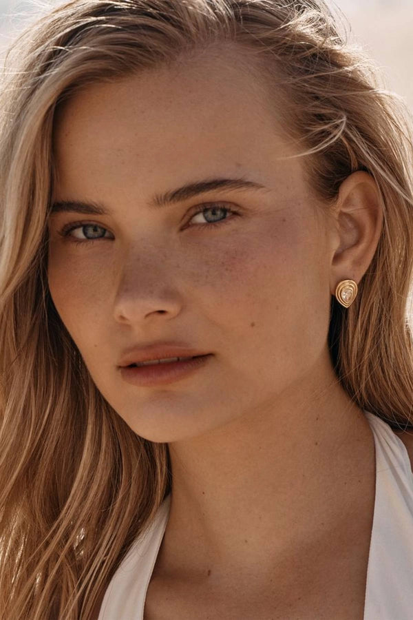 Dune Earrings by Amber Sceats - gold earrings with teardrop crystals and polished frame, designed for elegant everyday styling.