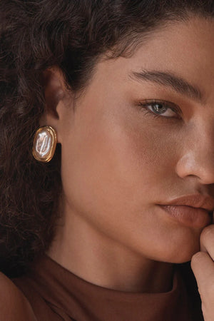 Duomo Earrings by Amber Sceats, sculptural gold-plated hoops with oversized freshwater pearl, a bold trendy piece perfect for timeless elegance.