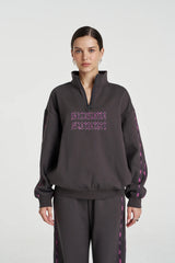 Eden Zip Neck Jumper Shadow by Summi Summi – acid wash cotton jumper with zip neck and plaid trim details.