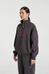 Eden Zip Neck Jumper Shadow by Summi Summi – acid wash cotton jumper with zip neck and plaid trim details.