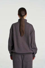 Eden Zip Neck Jumper Shadow by Summi Summi – acid wash cotton jumper with zip neck and plaid trim details.