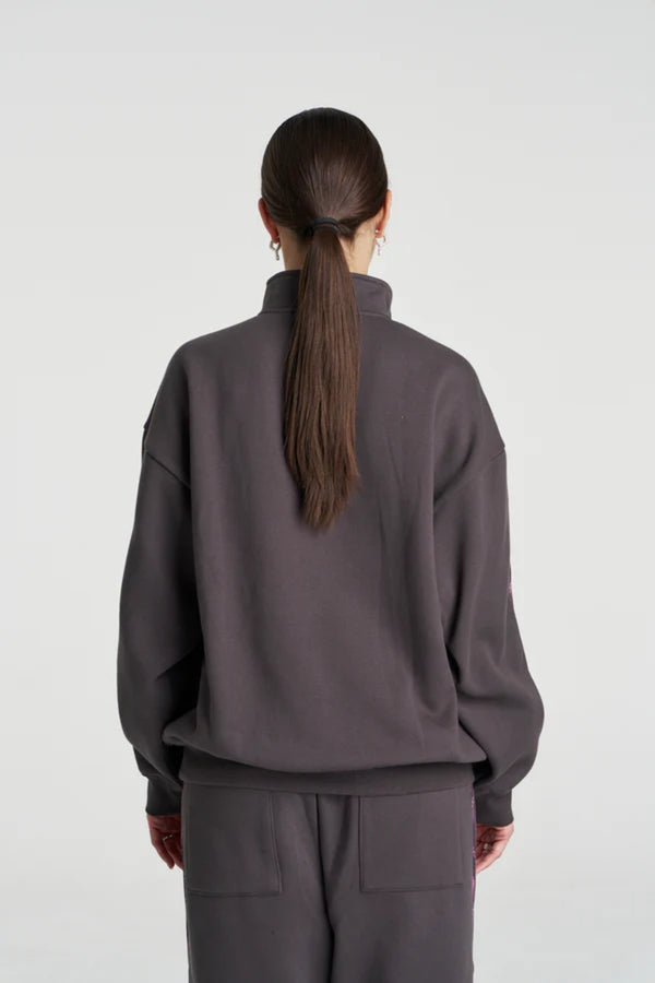 Eden Zip Neck Jumper Shadow by Summi Summi – acid wash cotton jumper with zip neck and plaid trim details.