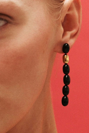 Edith Earrings in Black/Gold by Heaven Mayhem – gold twisted-bead drop earrings with sculptural movement and shine, perfect for refined everyday styling.