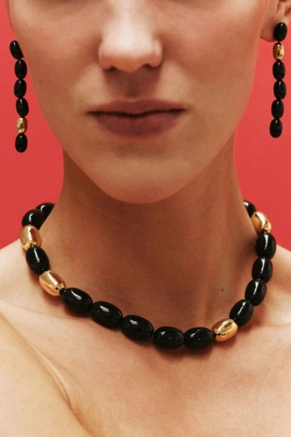 Edith Earrings in Black/Gold by Heaven Mayhem – gold twisted-bead drop earrings with sculptural movement and shine, perfect for refined everyday styling.