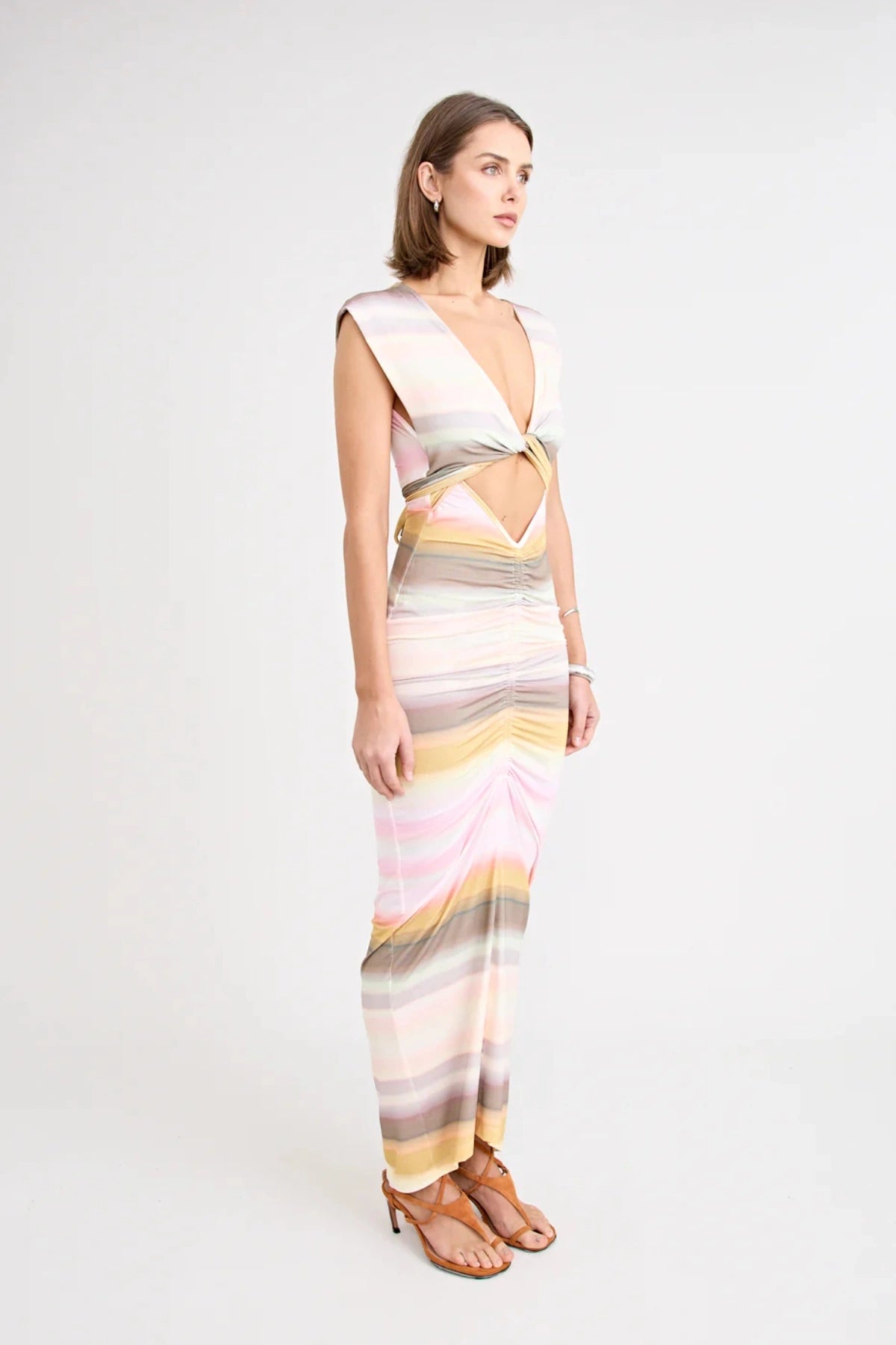 Elara Dress by Pfeiffer — a peach-toned stretch jersey midi with adjustable ties and front ruching for a custom, flattering silhouette.