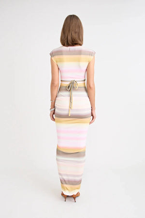 Elara Dress by Pfeiffer — a peach-toned stretch jersey midi with adjustable ties and front ruching for a custom, flattering silhouette.