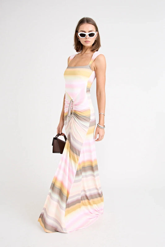 Elara Dress by Pfeiffer the Label, a printed stretch maxi with gathered sides and front split. Perfect for day-to-night styling.
