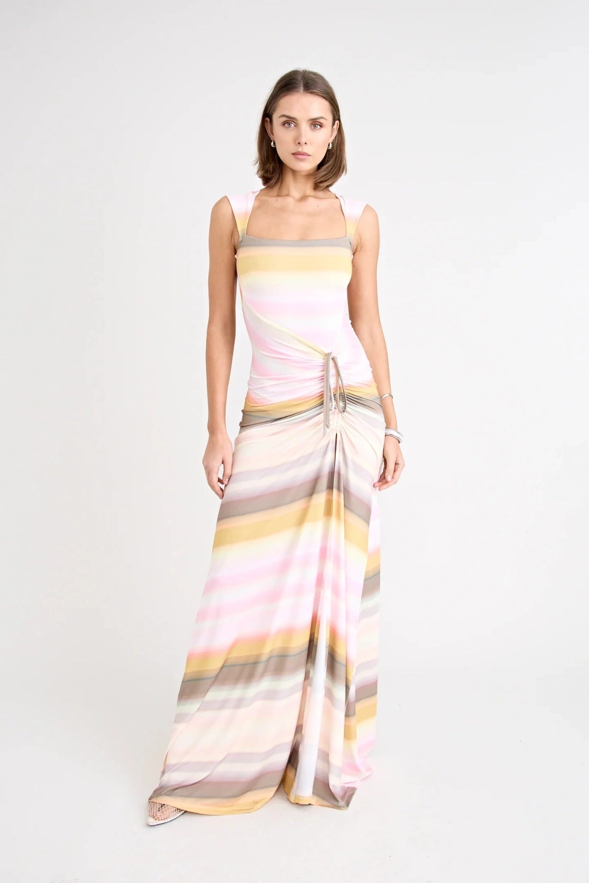Elara Dress by Pfeiffer the Label, a printed stretch maxi with gathered sides and front split. Perfect for day-to-night styling.
