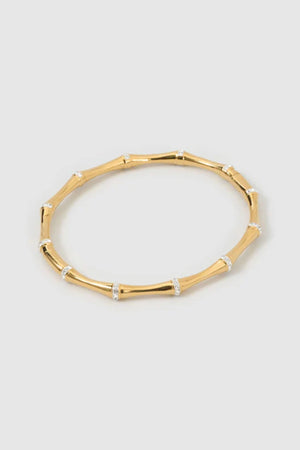 Electra Gold Cuff by Arms of Eve, sculptural gold cuff adorned with shimmering zircon stones for a bold, glamorous statement from day to night.