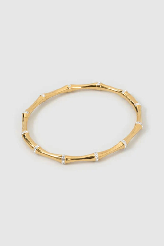 Electra Gold Cuff by Arms of Eve, sculptural gold cuff adorned with shimmering zircon stones for a bold, glamorous statement from day to night.
